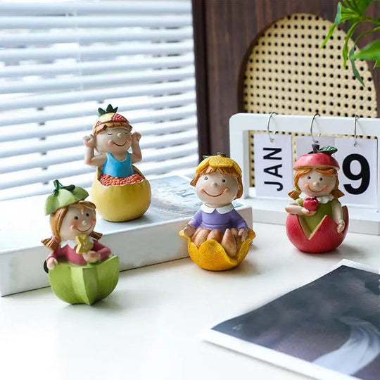 Cute figurine of a girl in resin with fruit motif