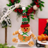 Peperkoekman zittend pop kerstboom hanger
