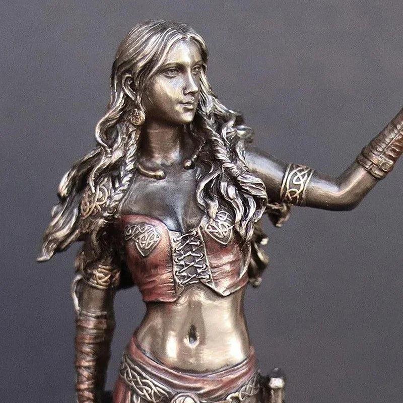 Goddess figurine with crow and sword