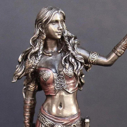Goddess figurine with crow and sword