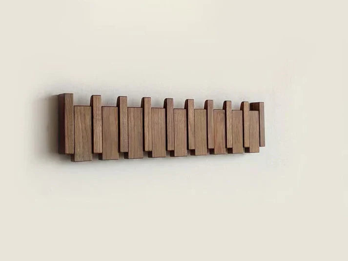 Elegante appendiabiti in legno con design a pianoforte