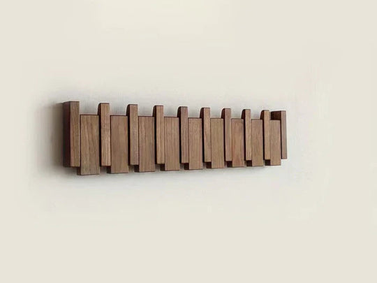 Elegante appendiabiti in legno con design a pianoforte
