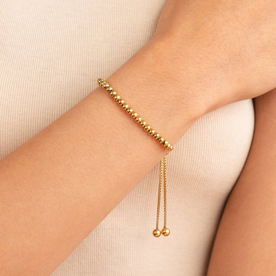 Braccialetto d'oro con perline