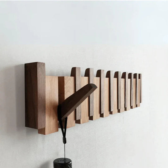 Elegante appendiabiti in legno con design a pianoforte